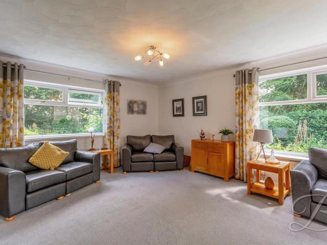 If there's one room in the property that has the wow factor, it's this living room. It is beautifully decorated and boasts triple-aspect windows.