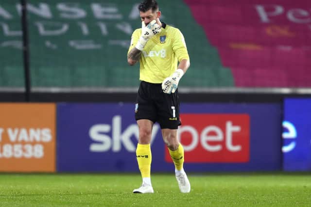 Sheffield Wednesday goalkeeper Keiren Westwood leaves the pitch with an injury just a few minutes in to their clash with Swansea City.