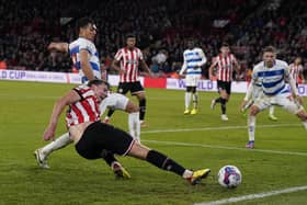 Sheffield United's Sander Berge was injured during this challenge with QPR's Andre Dozzell: Andrew Yates / Sportimage