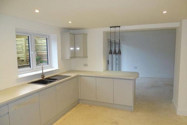 The family kitchen opens to the dining room.