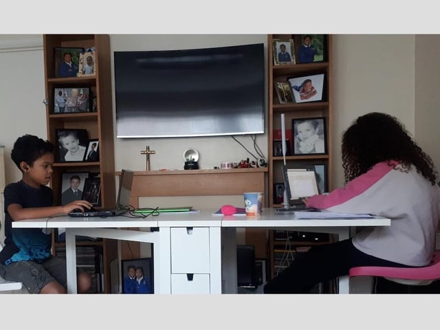 Model pupils Ellis and Daniella work in harmony to make the best of their home classroom.