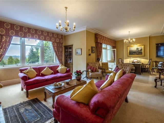 The elegant and extensive drawing room is L-shaped with handcrafted fitted cabinets and has garden views and access into the delightful conservatory.