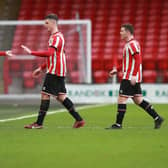 John Fleck and Ciaran Clark of Sheffield United make way during the U21s derby against Sheffield Wednesday