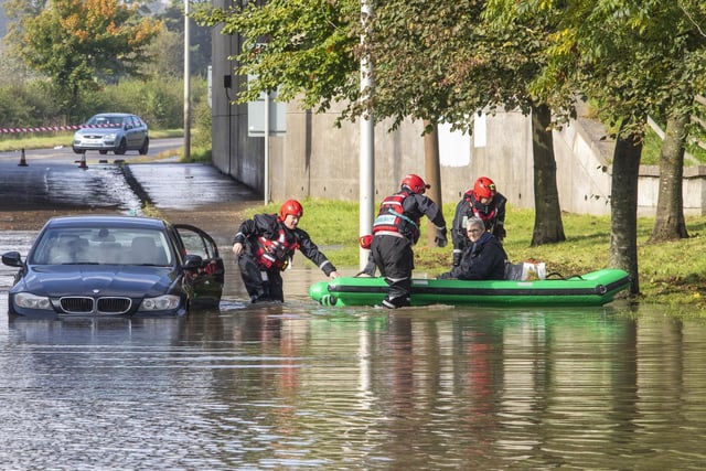 A driver being rescued from their car by emergency services after extreme weather conditions brought by Storm Alex flood Kirkliston, West Lothian.