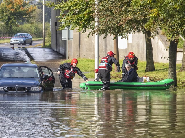 A driver being rescued from their car by emergency services after extreme weather conditions brought by Storm Alex flood Kirkliston, West Lothian.