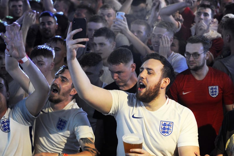 Jubilant England fans watching the World Cup quarter final win over Sweden at Walkabout Bar on Carver Street, Sheffield in July 2018