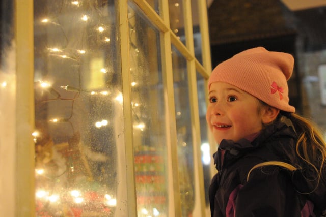 Five year old Grace Smith is pictured looking at one of the decorated windows on the quayside at the Hartlepool's Maritime Experience in 2012.