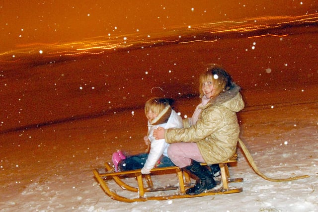Alicia, 3, and Marie King, 8,  enjoy the snow on Fisher Lane Recreation Ground in 2009