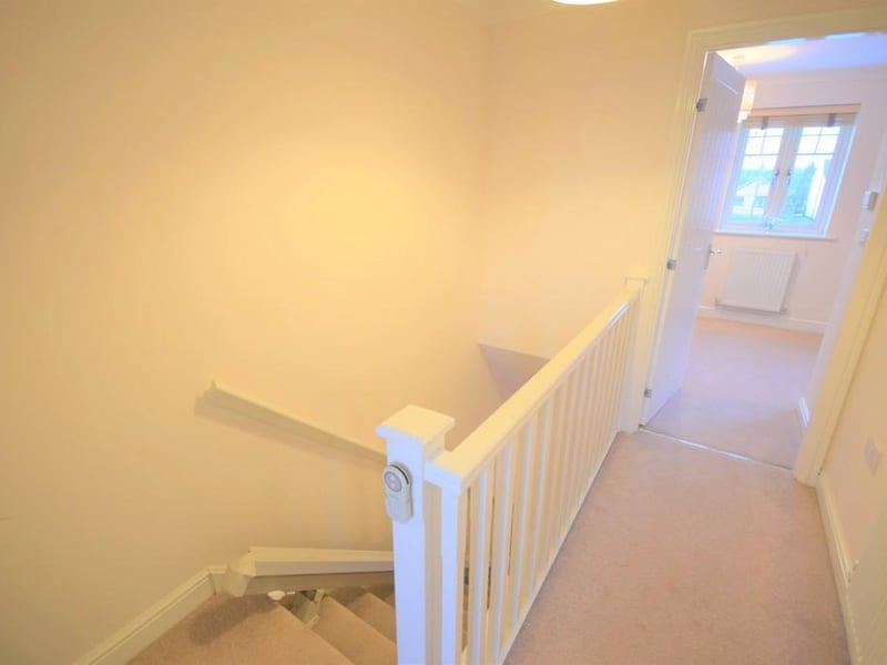 Landing area having internal doors to the bedrooms and shower room, radiator.