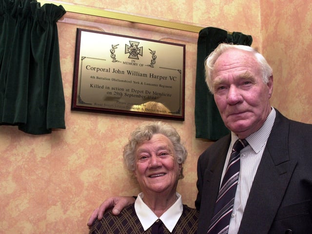 The brother and sister of Victoria Cross winner Corporal John Harper, Peter Harper and Joan Willis are pictured with the plaque in his honour, which was unveiled by Mrs Willis at the Mansion House, Doncaster in 2001