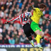 Oliver Norwood of Sheffield United tussles with Josh Sargent of Norwich City  during a raucous match at Bramall Lane: Simon Bellis / Sportimage