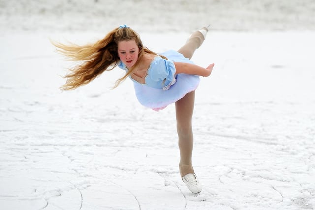 Stirling New Figure Skating Club member Rachael Hodge 11 training on an ice puddle in a Denny field