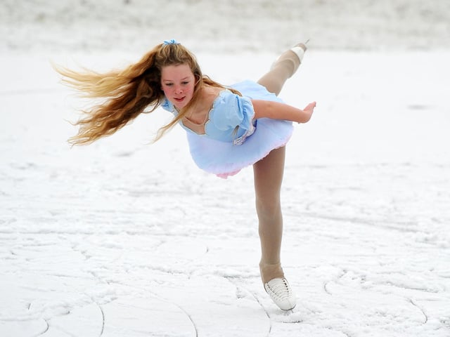 Stirling New Figure Skating Club member Rachael Hodge 11 training on an ice puddle in a Denny field