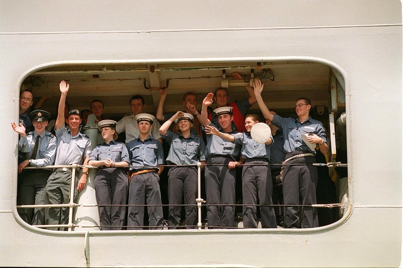 Crew members on HMS Invincible wave to their gathered famillies as the great ship docks in 1999.
Picture: Pete Langdown. The News 992543-2