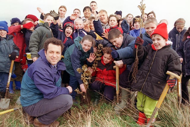 Swinton Brookfield Junior School pupils helped Andy Birch, Dearne Valley College outdoor classroom co-ordinator and public service students plant trees on pit pony field between the College and Swinton in 1999