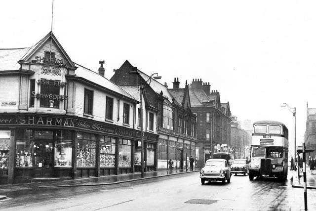 Sharman's Grocers at the junction of West Street with Fitzwilliam Street pictured here in January 1961.  The caption reads "An illustration of a self-contained shopping centre, away from mid-city bustle, yet with stores to meet virtually every demand of the housewife and her family"
