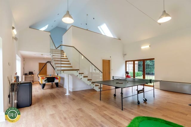 The large games room is part of a leisure suite within the house.