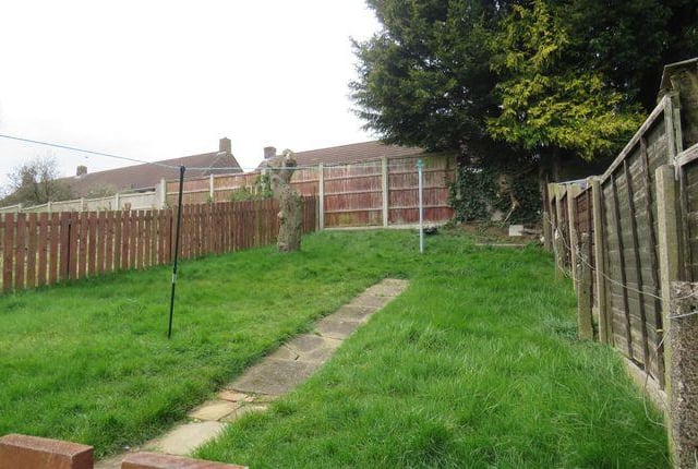 This house has a utility room and lawned garden.