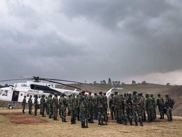 Soldiers of the Congolese army are reviewed by General Philemon Yav during an official visit to Bijombo.