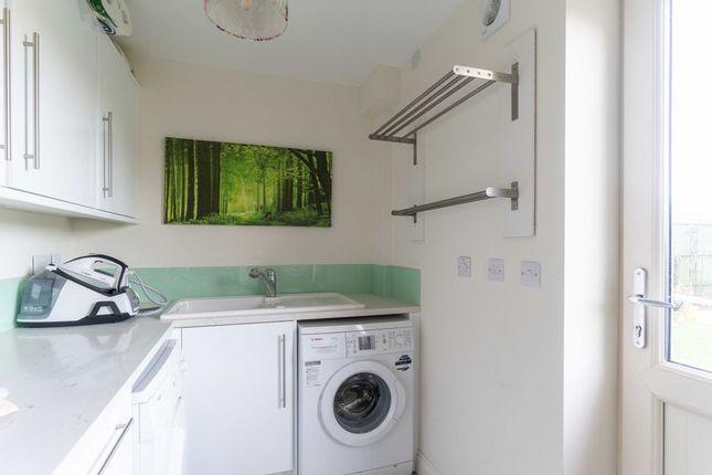 Downstairs, there’s also a utility room which has direct access to the garden