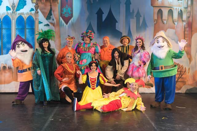 The cast of Manor Operatic pantomime Snow White on stage at Sheffield City Hall