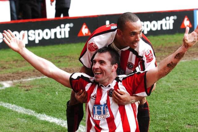 Sheffield United's David Unsworth celebrates his winning goal against Hull City with team-mate Danny Webber: PA