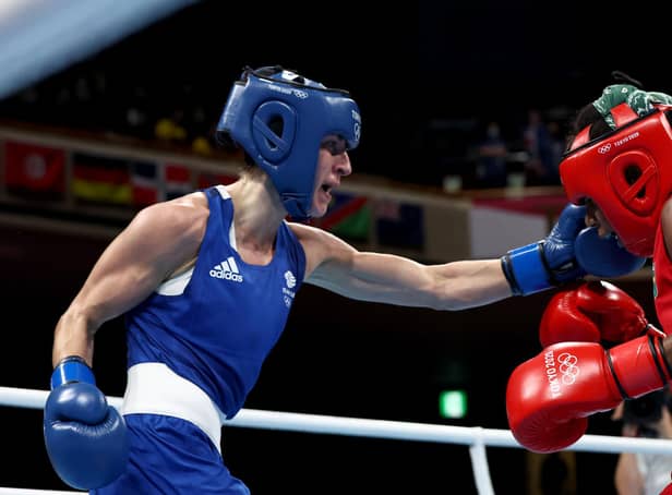 Jucielen Romeu (R) of Brazil exchanges punches with Karriss Artingstall of Great Britain during the Women's Feather (54-57kg).