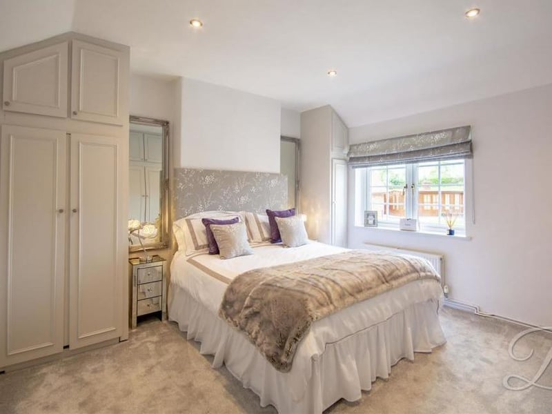 The second bedroom lacks for nothing in comfort. Fitted wardrobes, a carpeted floor, central-heating radiator and a window to the back are among its assets.