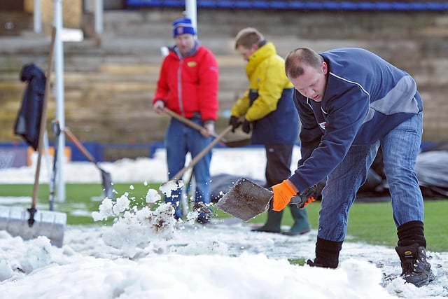 Volunteers clearing the hard-packed snow at Starks Park, Kirkcaldy