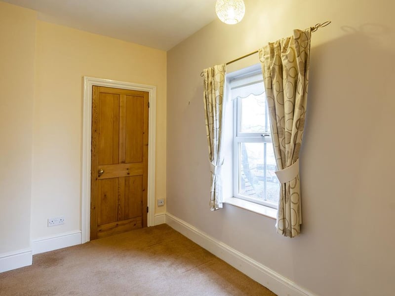 With carpet to flooring, central heating radiator, cupboard for additional storage and a window to the side elevation.