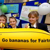 Going bananas: McAuley School pupils, from left, Gemma Currie, aged 15, Casey Helm, aged 11, Liam Oliver and Amber Mitchell, both aged 12, promote the Fairtrade babana event which took take place at the school in  2002