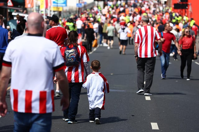 A young fan walks to the match in an oversized football shirt prior to the Sky Bet Championship Play-Off Semi Final 1st Leg match between Sheffield United and Nottingham Forest