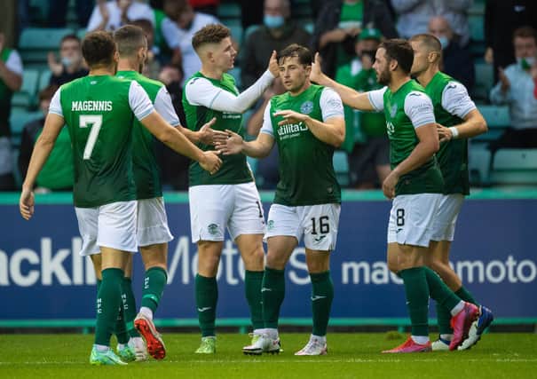 The Hibs players celebrate Kevin Nisbet's goal