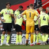 Chris Wilder, manager of Sheffield United talks with his players during drinks break during the Premier League match between Southampton FC and Sheffield United (Photo by Andrew Boyers/Pool via Getty Images)