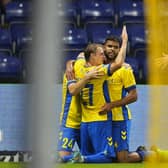 Brondby's Swedish forward Simon Hedlund (L) and Brondby's Tunisian midfielder Anis Ben Slimane (C) celebrate a goal during the UEFA Europa Conference League third qualifying round, first leg football match between Brondby IF and FC Basel at Brondby Stadium: CLAUS BECH/Ritzau Scanpix/AFP via Getty Images