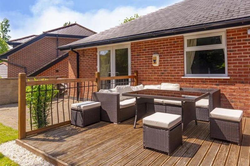 Decking, table and chairs for socialising outside. Perfect if you want to invite guests for a party.