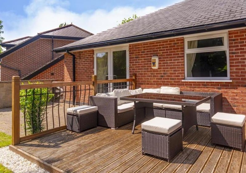 Decking, table and chairs for socialising outside. Perfect if you want to invite guests for a party.