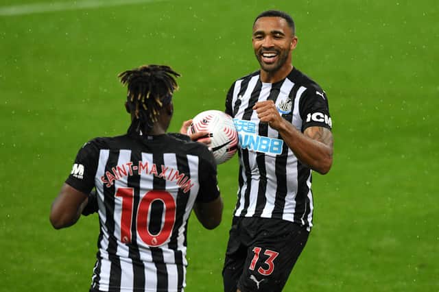 NEWCASTLE UPON TYNE, ENGLAND - OCTOBER 03: Callum Wilson of Newcastle United celebrates with teammate Allan Saint-Maximin after scoring his team's second goal during the Premier League match between Newcastle United and Burnley at St. James Park on October 03, 2020 in Newcastle upon Tyne, England. Sporting stadiums around the UK remain under strict restrictions due to the Coronavirus Pandemic as Government social distancing laws prohibit fans inside venues resulting in games being played behind closed doors. (Photo by Stu Forster/Getty Images)