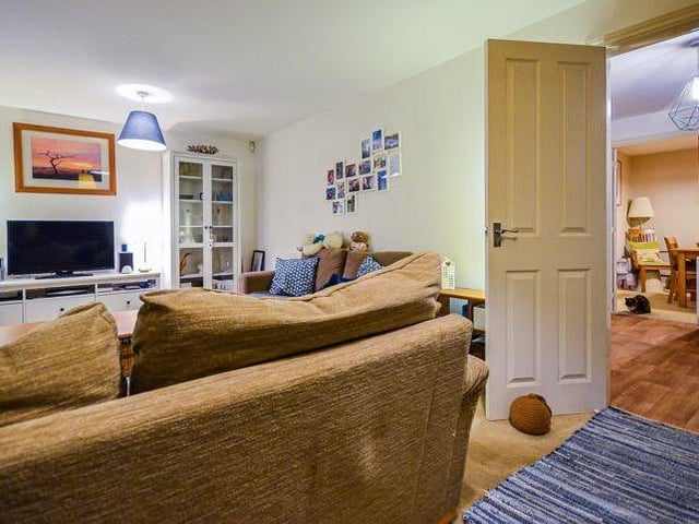 As you can see, the living room leads into the hallway and through to the separate dining room. The property has a nice flow to it.