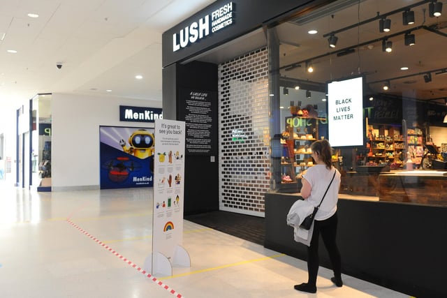Queuing for Lush in Cascades Shopping Centre in Portsmouth. Picture: Sarah Standing (150620-9855)