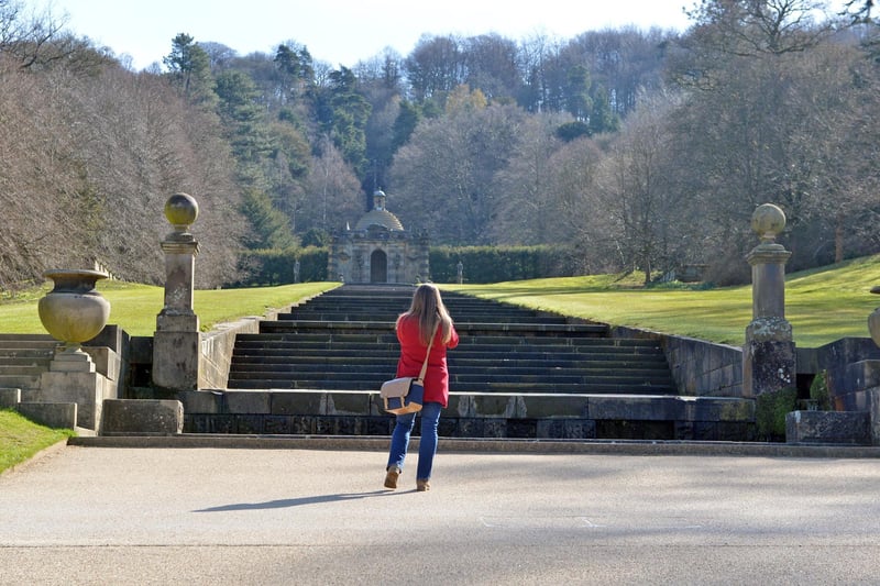 A visitor admires one of the features of Chatsworth gardens.
