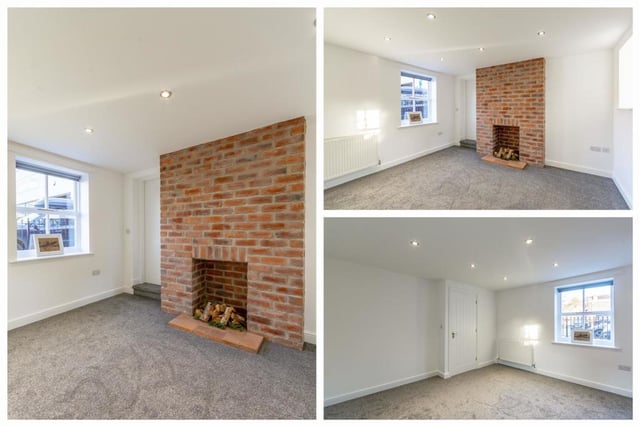 The living room boasts an eyecatching brick feature wall, which easily accommodates a log burner. With a new carpet, spotlights and double-glazed sash windows to the front and back, the room provides the ideal setting for relaxing with the family or with friends.