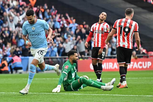 Manchester City's Riyad Mahrez (L) celebrates scoring the team's second goal against Sheffield United (GLYN KIRK/AFP via Getty Images)