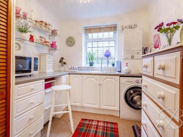 The handy utility room is as homely as the rest of the Abbott Road property. It contains a range of units and cabinets with work surfaces over, plenty of storage, an inset sink and drainer, and space and plumbing for a washing machine.
