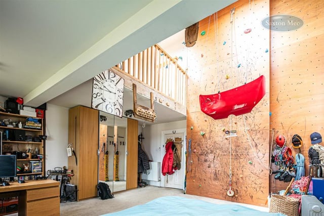 A climbing wall inside one of the bedrooms. Image: Saxton Mee/Dug Wilders Photography