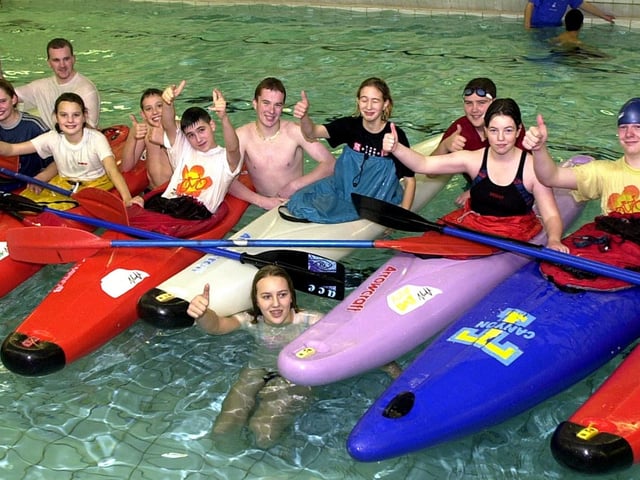 Cassandra Slater (in the pool), aged 15, of Kirk Sandall, who organised the canoe rolls for Children in Need lines up with those who took part the event Don Valley School's swimming pool back in 2002