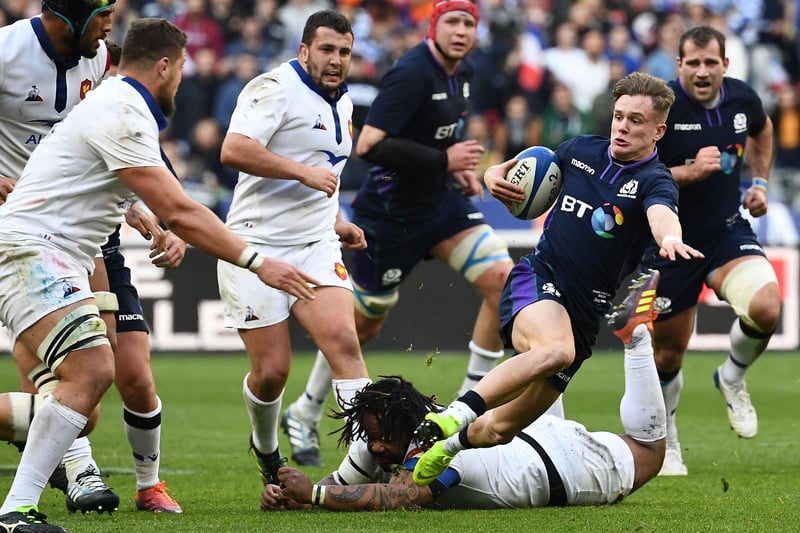 February 23, 2019, Six Nations: France 27, Scotland 10
A 78th-minute Ali Price try was the only response Scotland could muster as four tries won the Auld Alliance Trophy for France for the first time.
Darcy Graham runs with the ball at the Stade de France in Saint-Denis, outside Paris. (Photo by Anne-Christine Poujoulat/AFP via Getty Images)