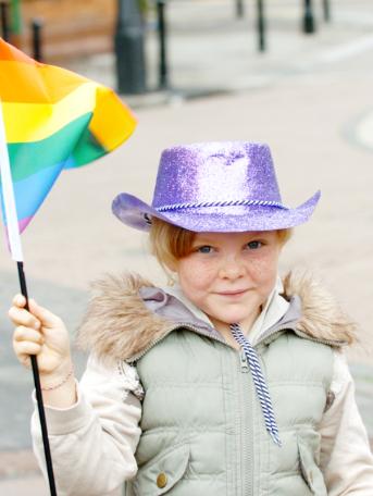 Bethany Simmons aged eight holding a pride flag in 2007.