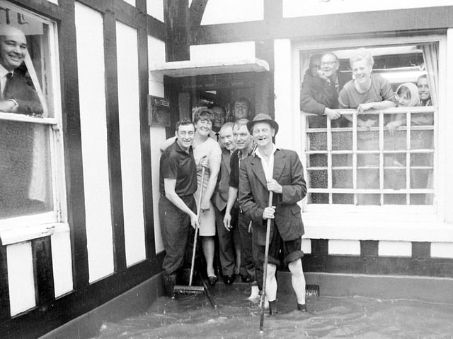 A blast from the past here - a bit of rain was not going to stop these regulars having their pint.
