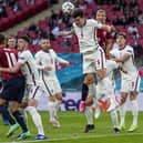 England's Harry Maguire heads the ball during the Euro 2020 soccer championship group D match between Czech Republic and England at Wembley. (AP Photo/Frank Augstein, Pool)